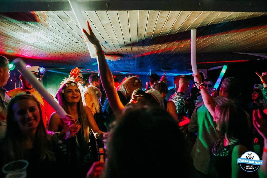 Inside of Krakow Boat Party with dancing people and LED lights