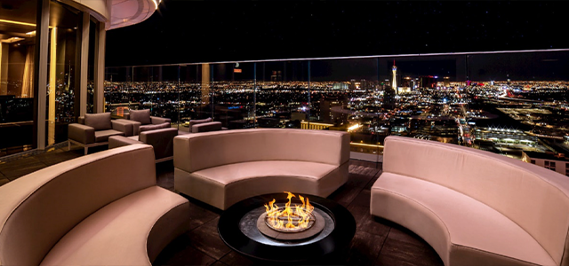 View from Circa's Legacy Club Rooftop bar; VIP seating in a circle around a firepit