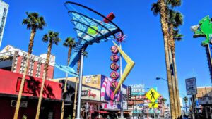 panning shot of fremont street featuring the iconic martini and vegas signs