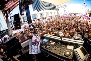 Labor Day Weekend pool party in Las Vegas with DJs and dancing crowd